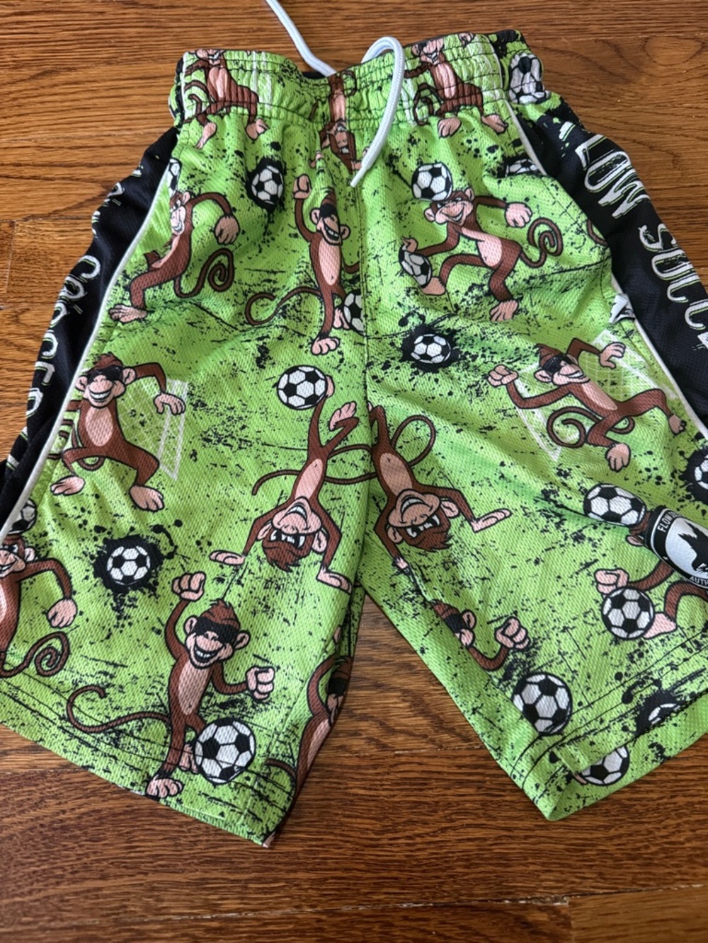 Playful Monkey Soccer Print Kids Shorts in Green